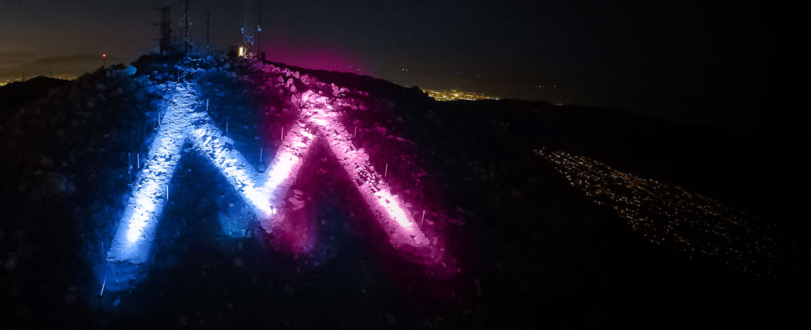 The M lit red, white and green to celebrate the holidays