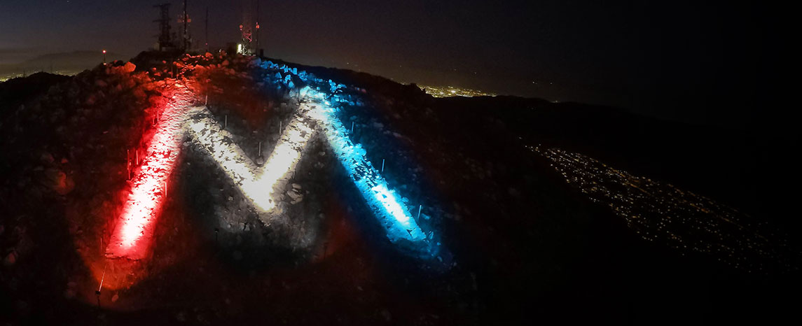 The M lit red, white and blue to honor heritage
