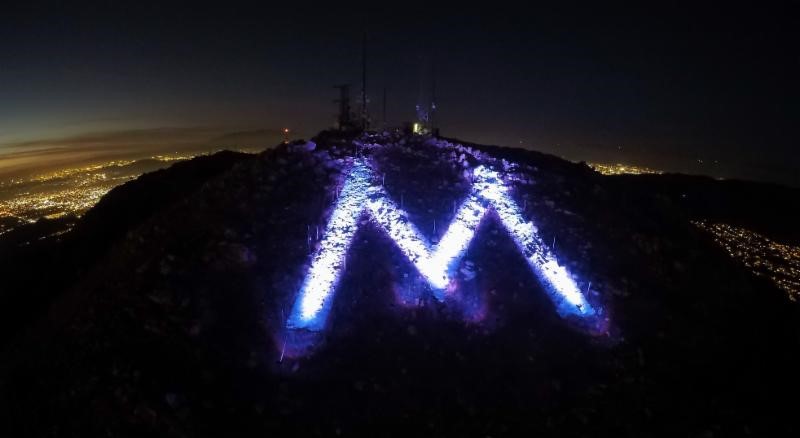 the "M" lit lavender