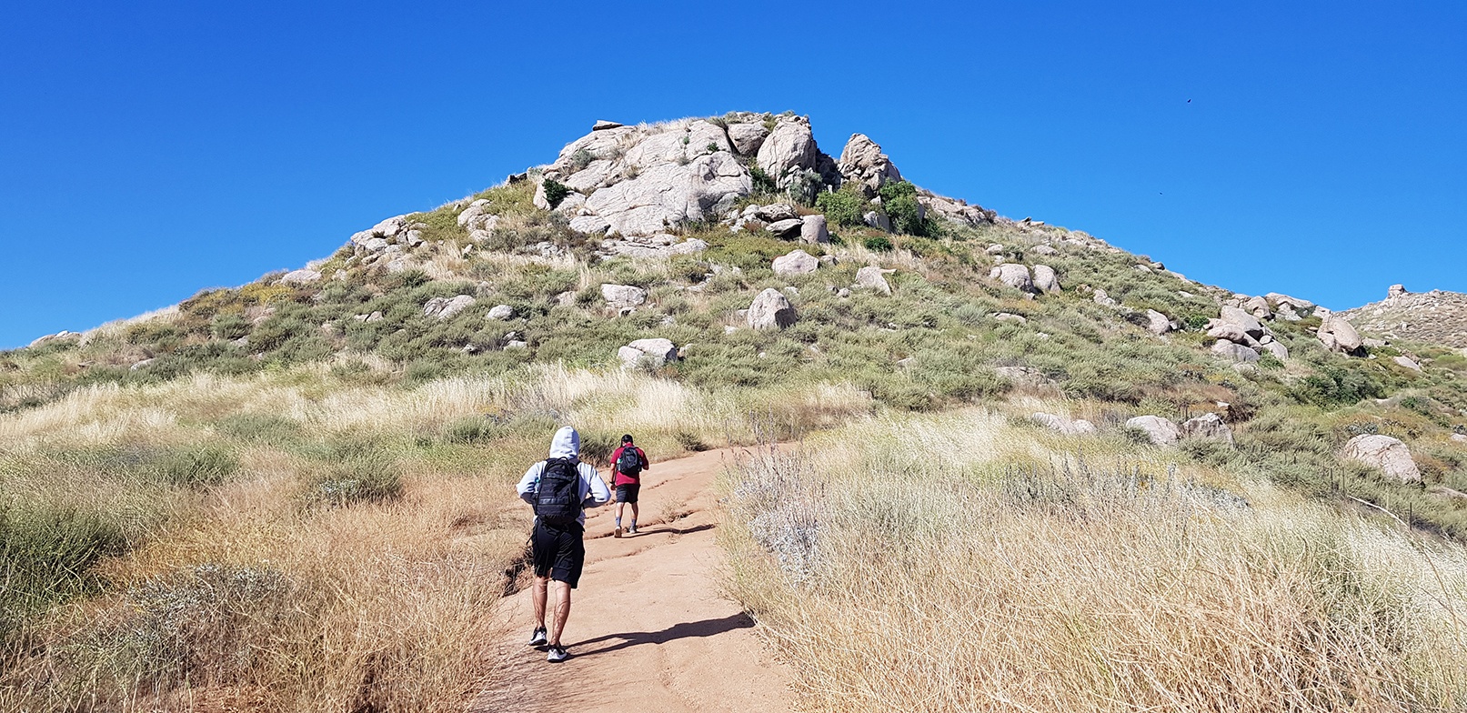 Two men hiking up Terri Peak